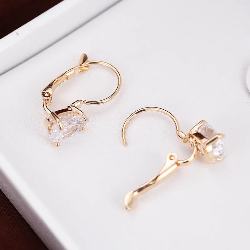 Copper drop-shaped earrings with platinum inlaid gemstone in gold and platinum colour options