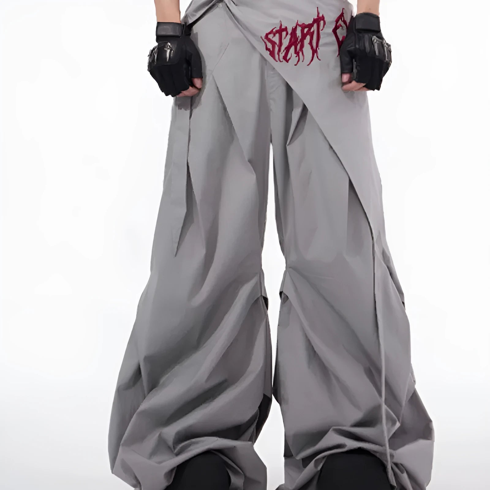 Boy modelling black wide-leg summer trousers with a relaxed fit and Korean-inspired style.
