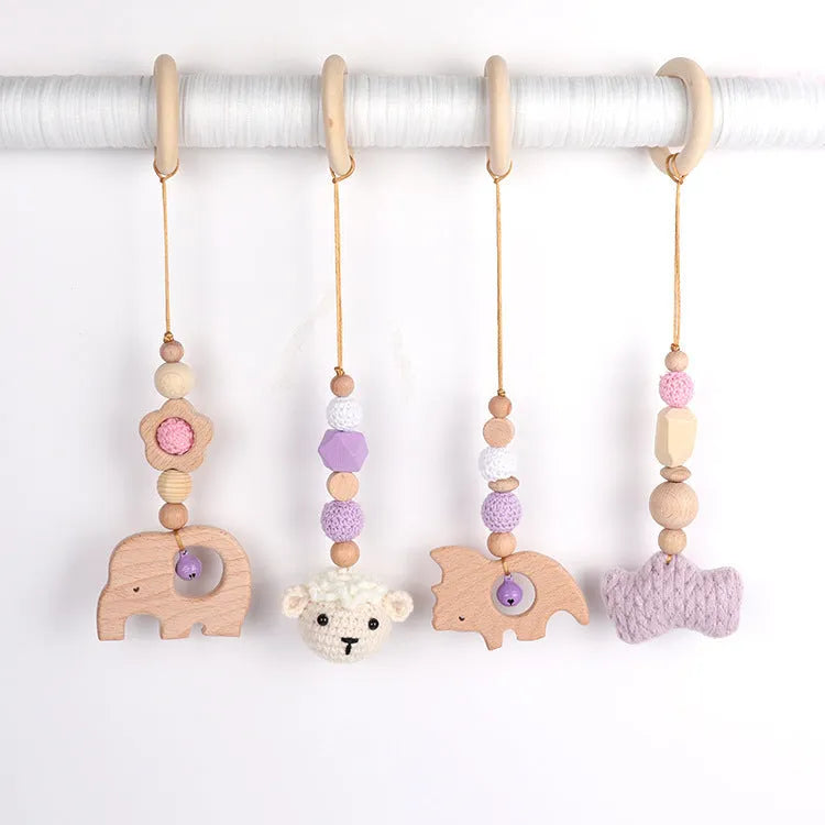 Beech wood baby rattle toy with animal decoration, 28cm long, available in six colours