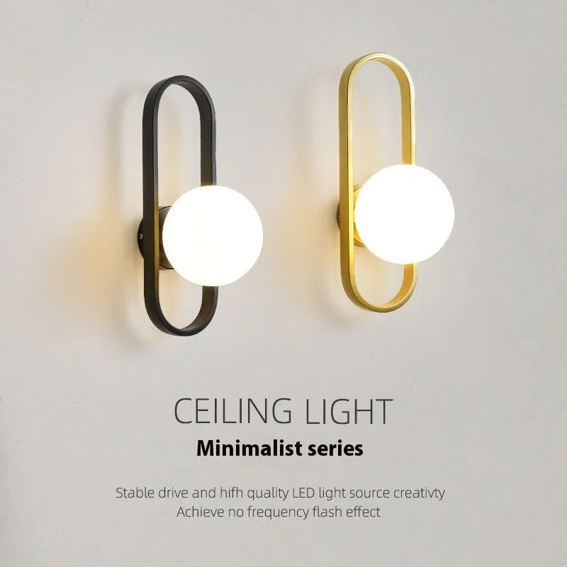 Minimalist wall lamp in black or gold with glass shade and iron body for bedroom corridor lighting
