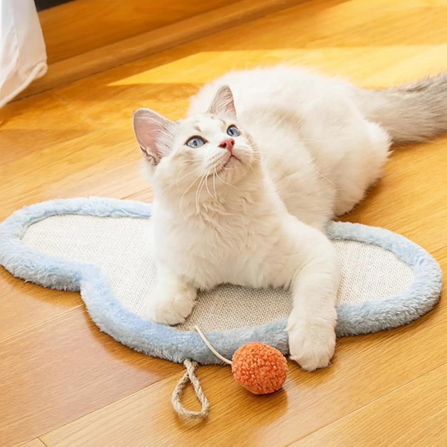 White cat scratching mat with sleeping cat pattern made from natural sisal rope