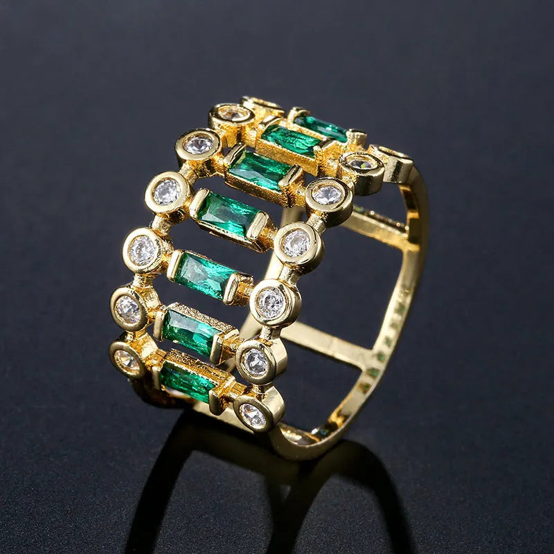 Gold-plated copper ring with hollow geometric setting and inlaid zircon stones