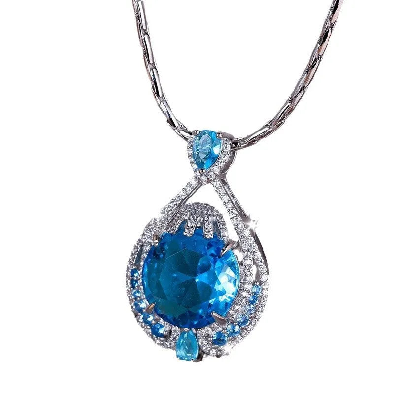 Blue geometric crystal pendant necklace on a silver water wave chain for women