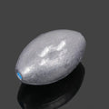 Olive lead fishing sinker with scale pattern showing rugby shape and plastic core construction