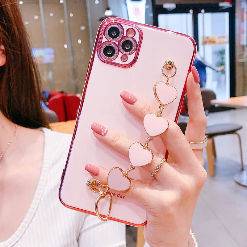 Green silicone phone case with attached bracelet for Samsung and iPhone Xr.