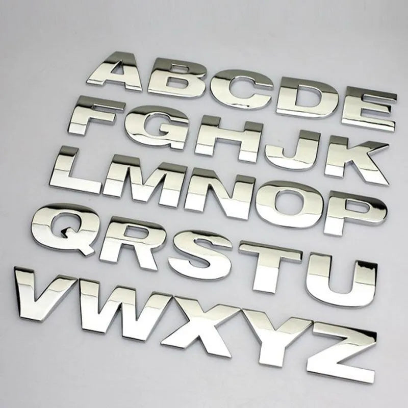 Close-up of a 3D metal zinc alloy car letter sticker in silver, showing its raised profile.