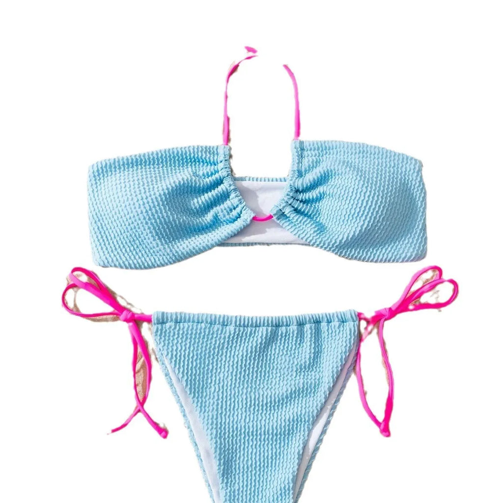 Solid colour women's halter neck lace-up bikini set with backless design on a mannequin