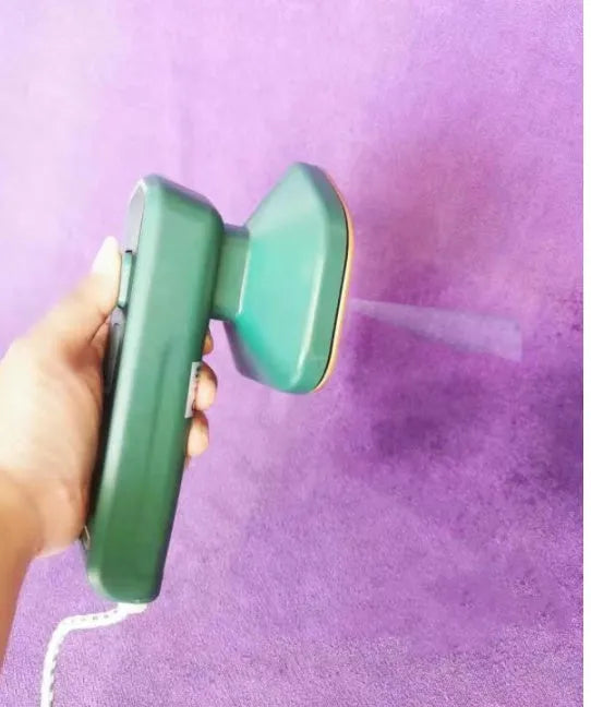 Dark green portable hanging steam iron with ceramic panel and handheld design