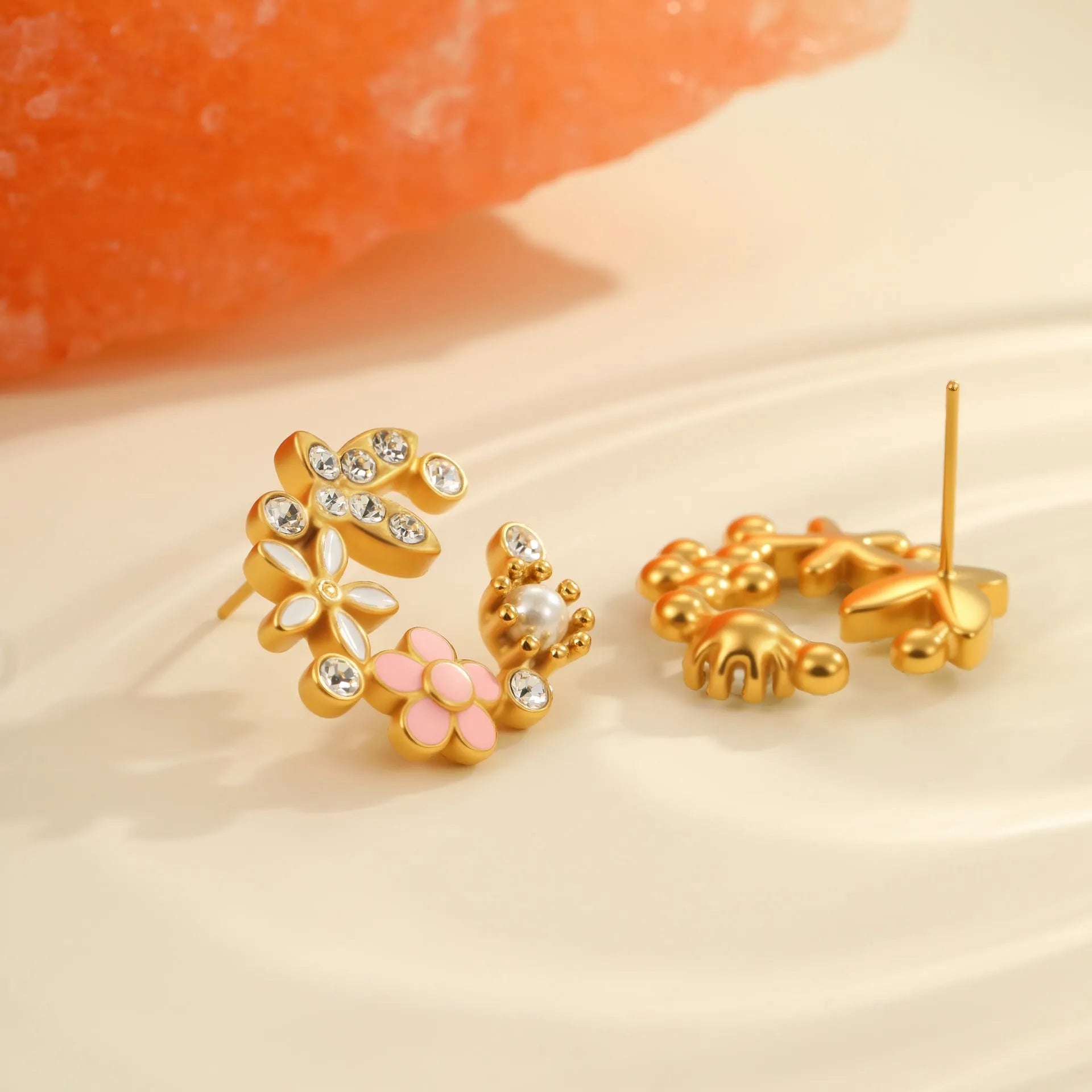 Colourful oil diamond flower stud earrings with gold plating on stainless steel.