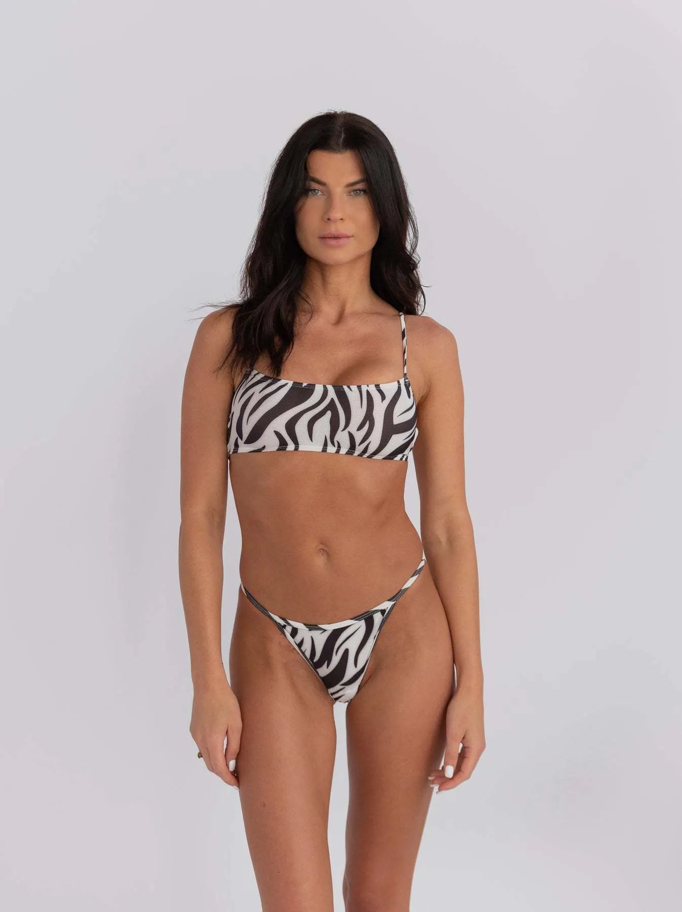 Women's striped banded bikini swimsuit set in blue and white on a mannequin.