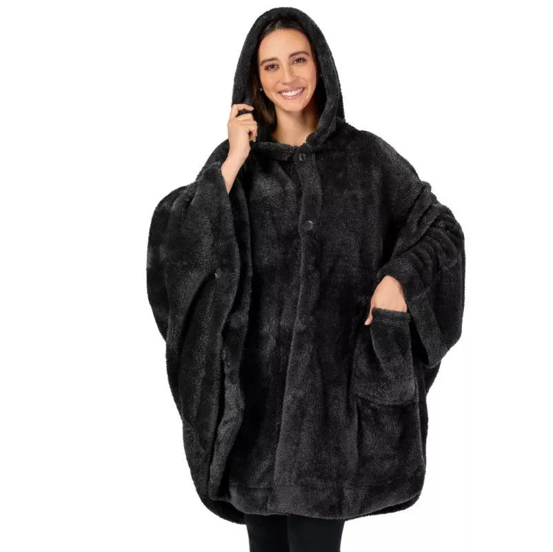 Thick pink hooded bathrobe with long sleeves and cardigan front on a hanger.