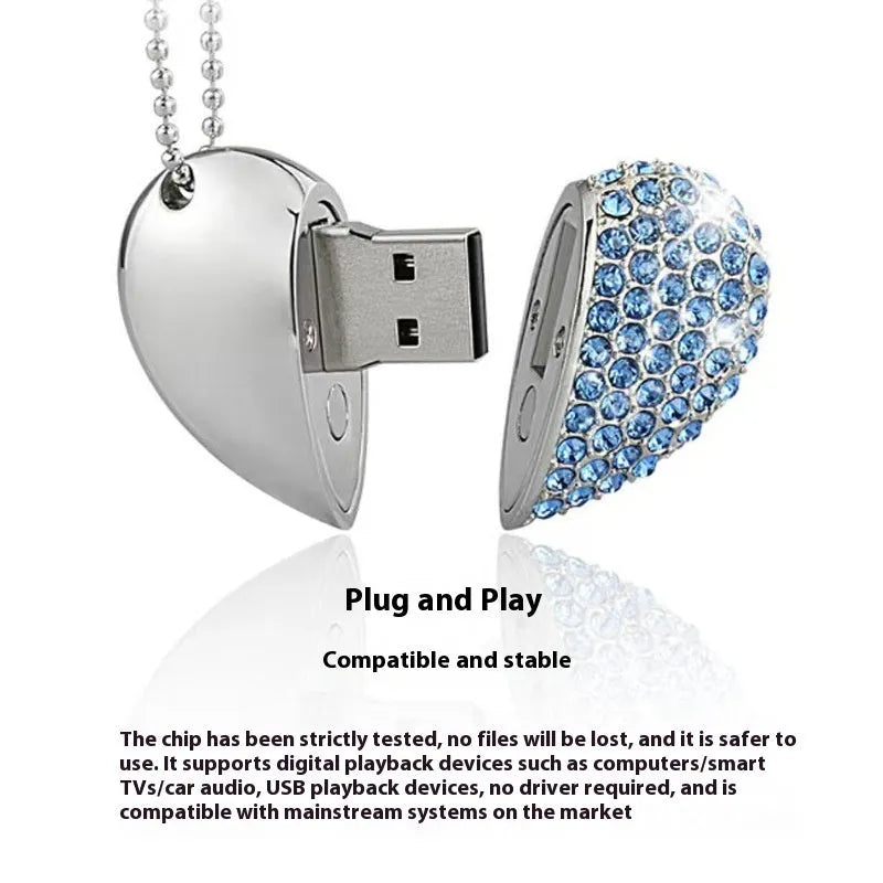 Blue metal USB flash drive with a brick-inlaid heart-shaped design, showing scale.