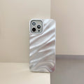 Soft solid colour wave pleated TPU protective case for Apple iPhone 17 series in burgundy on a white background.