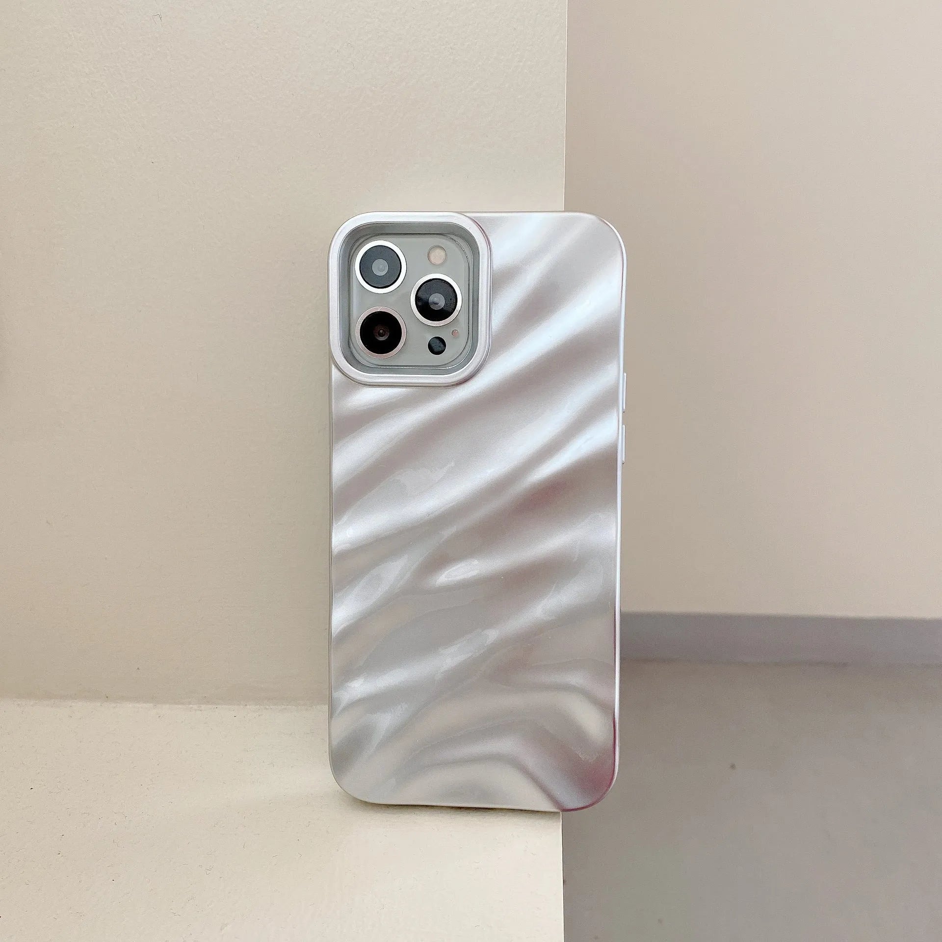 Soft solid colour wave pleated TPU protective case for Apple iPhone 17 series in burgundy on a white background.