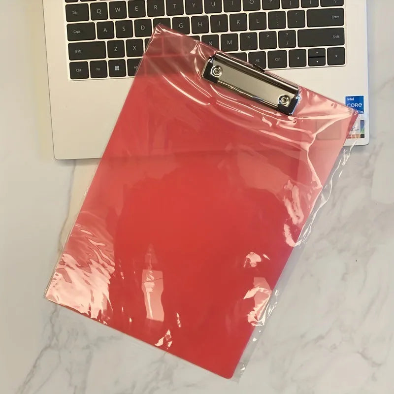 A4 transparent polypropylene clipboard with metal clip, shown in blue, holding paper.