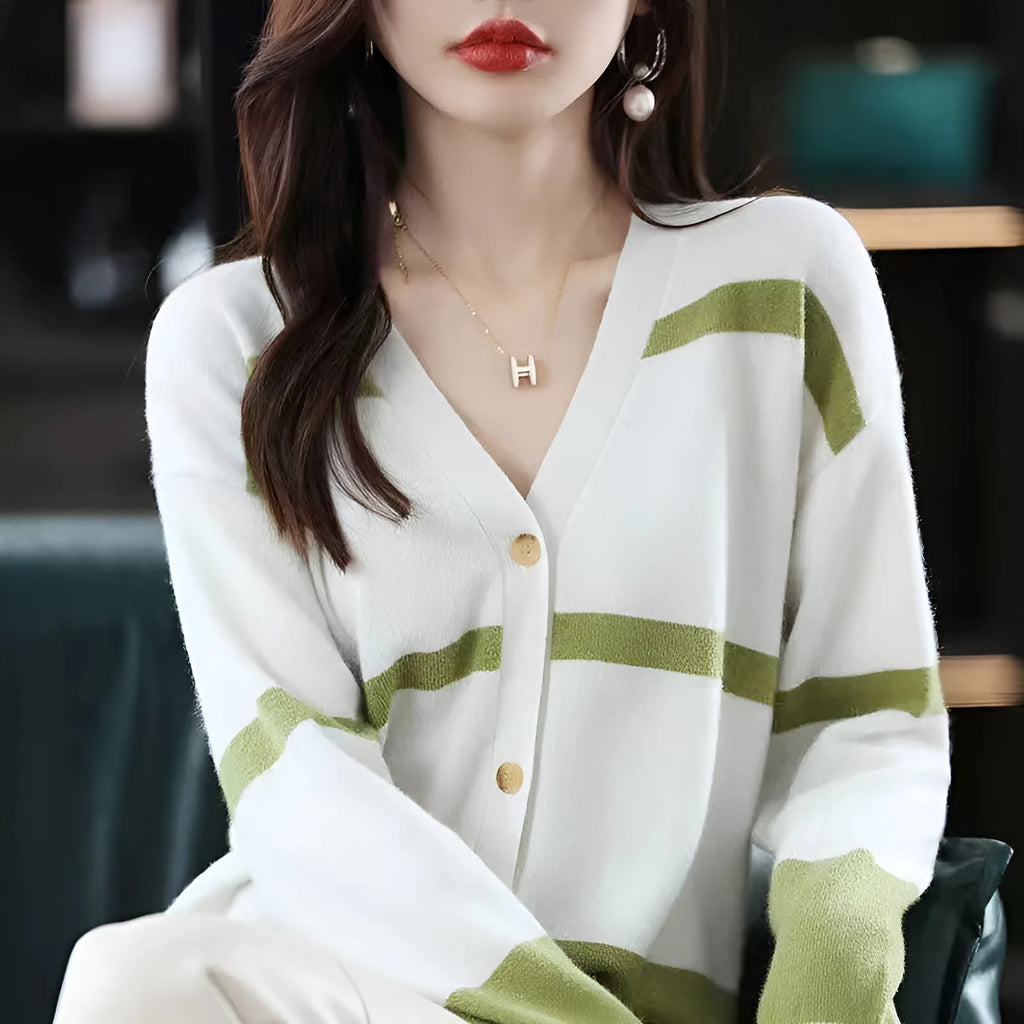 Women's black and white striped knitted cardigan with 3D pattern and V-neck.