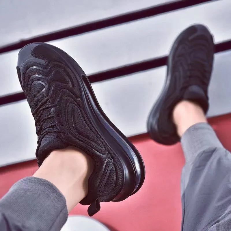 Men's black casual air cushion sneakers with lace-up front and thick sole.