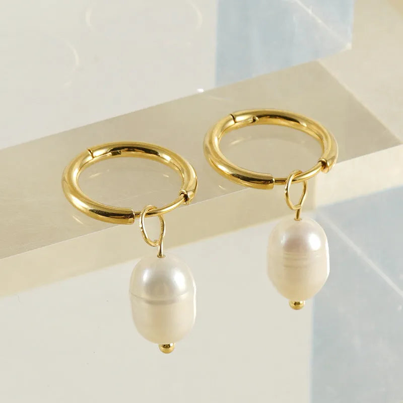Gold geometric pearl earrings made from stainless steel with titanium steel components