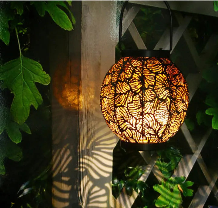 Hollow decorative iron solar lamp for outdoor courtyard use