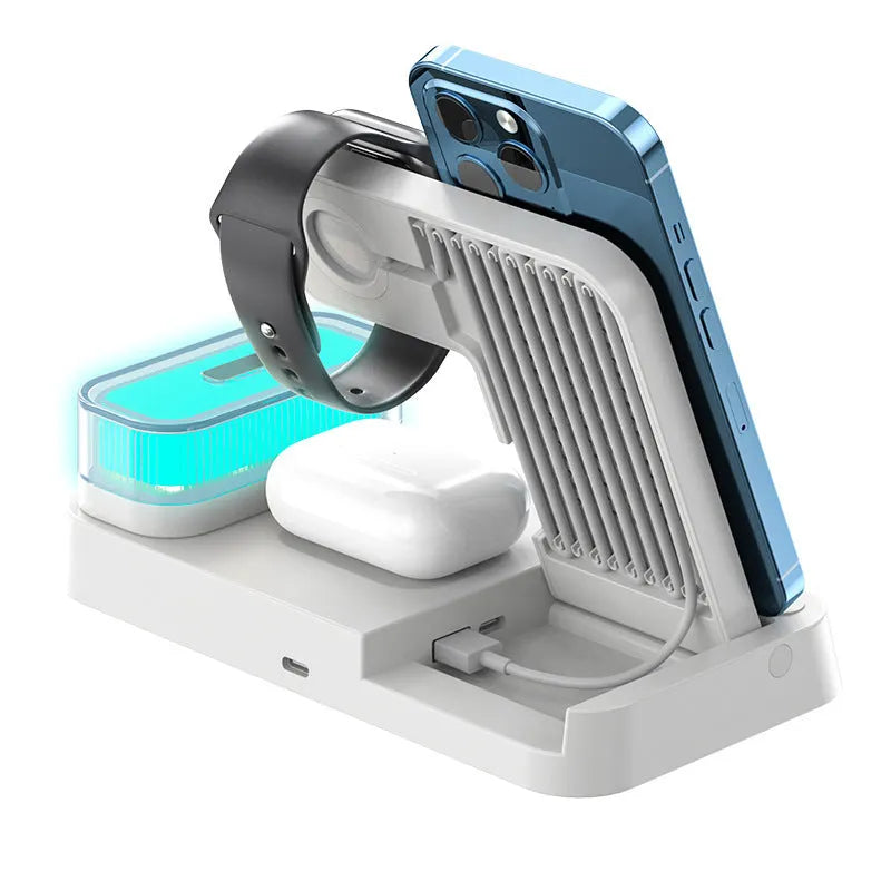 White 4-in-1 wireless charging station with foldable design showing phone charging, alarm clock display, and RGB night light