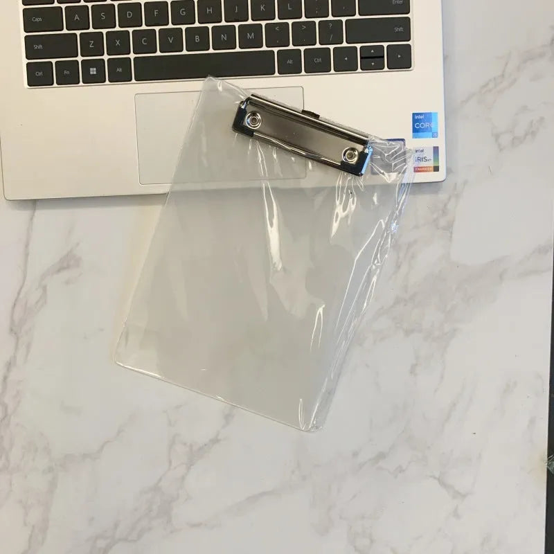 A4 transparent polypropylene clipboard with metal clip, shown in blue, holding paper.