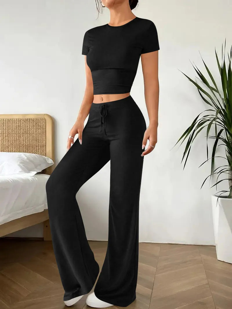 Women's black high waist trousers and short sleeve T-shirt two piece suit on hanger