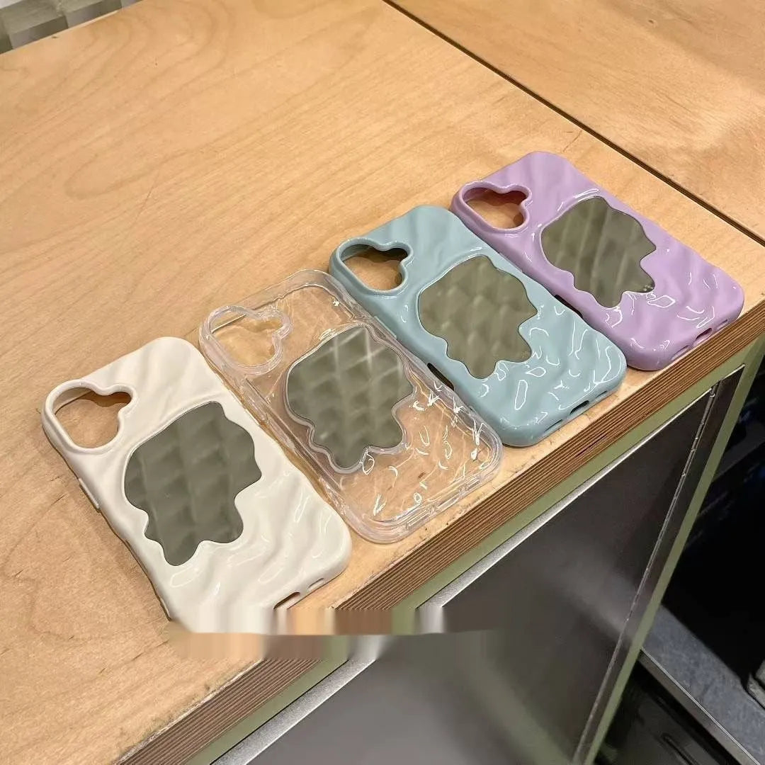 Simple solid colour iPhone case with water ripple texture and a small mirror, shown in beige.