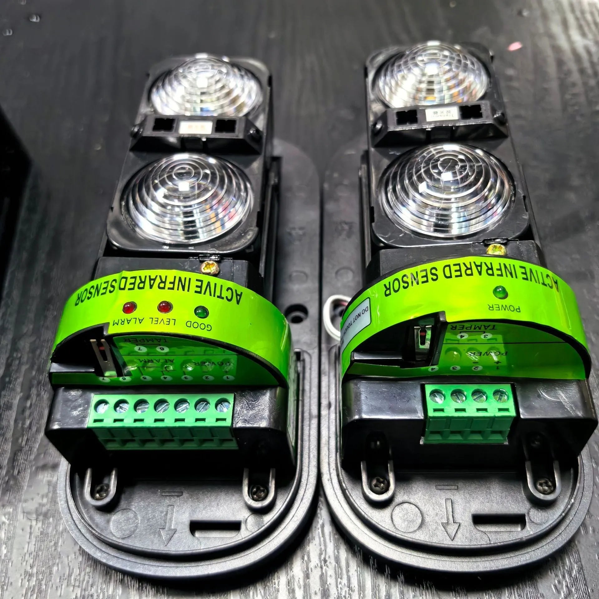 Black infrared security detector with wired connections for perimeter alarm systems