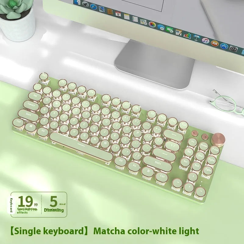Matcha green mechanical gaming keyboard with white backlighting on a desk