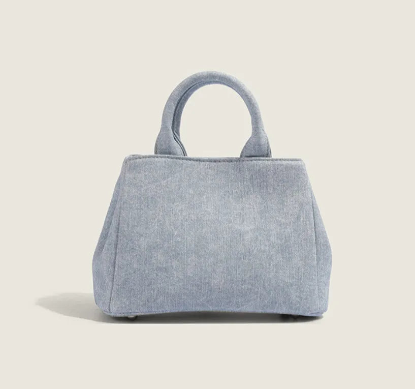 Women's denim blue casual shoulder bag made from soft PU leather with standard size dimensions