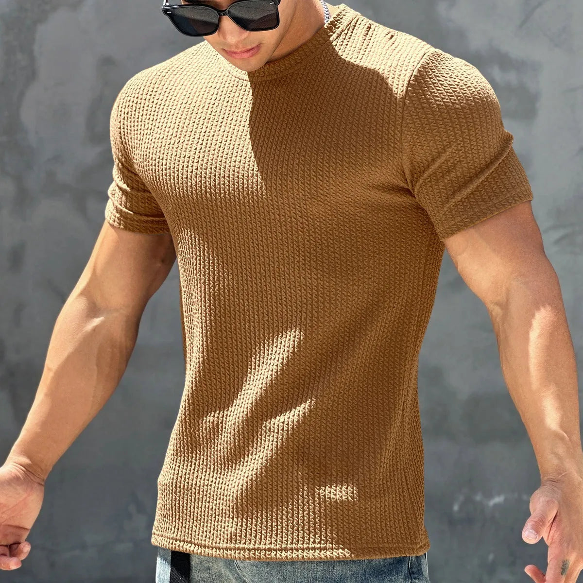 Men's sports textured quick-drying polyester T-shirt in black, short sleeve round neck, front view on model