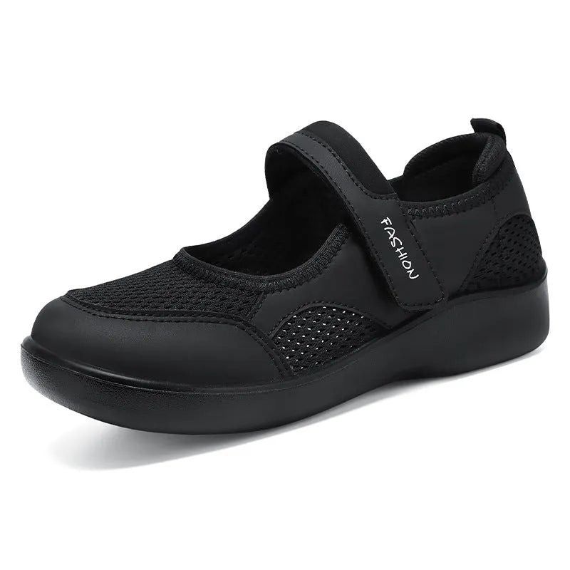 Women's low-top casual shoes in grey with mesh upper and Velcro strap.