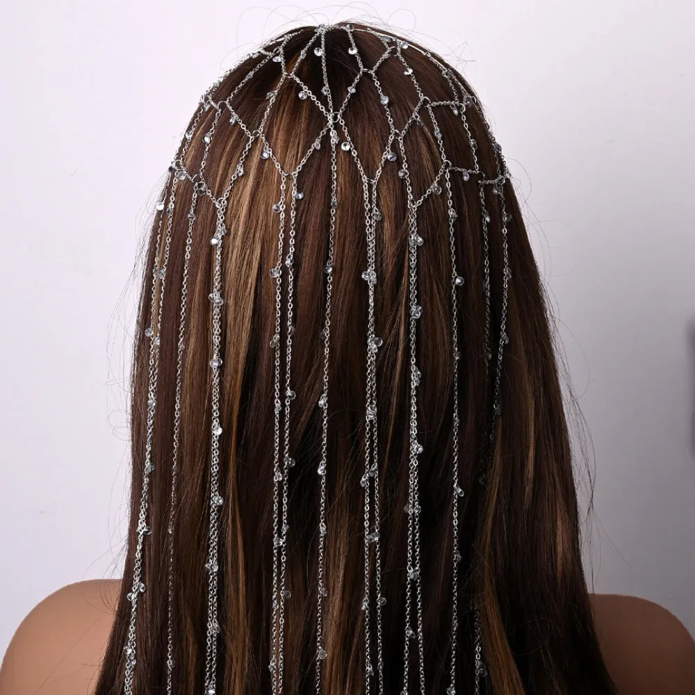 Rhinestone mesh headband with tassel detail in gold or silver electroplated finish