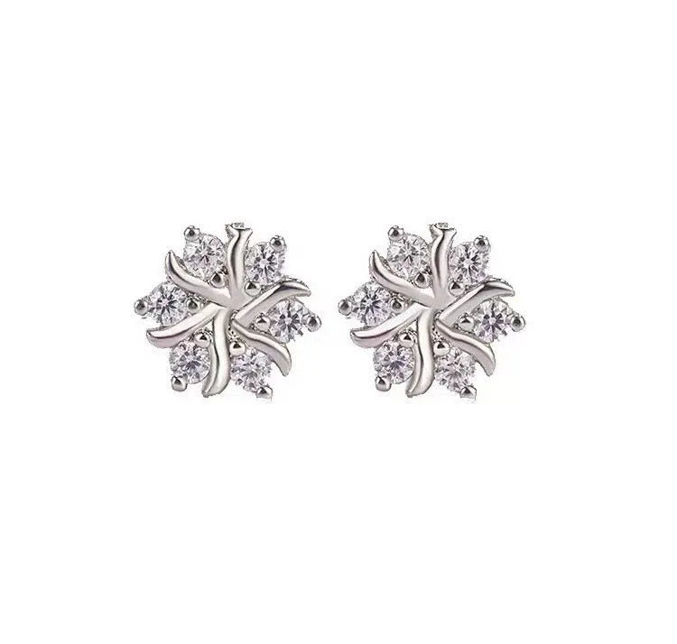 Silver snowflake ear stud earrings for women with zircon detail and copper base, geometric compact design.