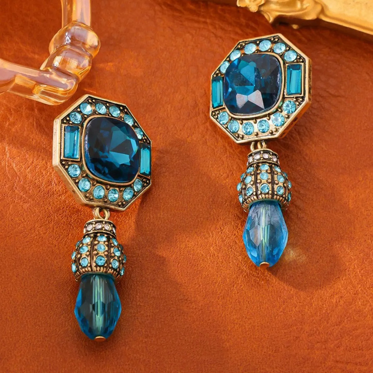Full-jeweled octagonal copper alloy stud earrings in blue colour with geometric Chinese style design