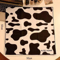 Blue Puppy printed nylon cosmetic bag showing zippered closure, shown next to medium and small size options.