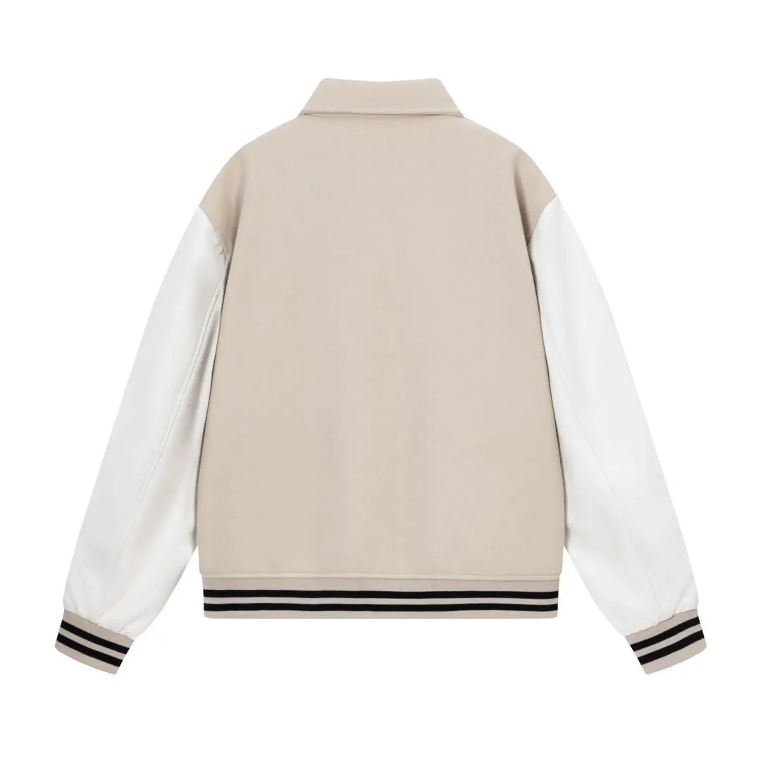 Women's apricot wool jacket with bone embroidery on the front, showing casual fit and stitch detail.