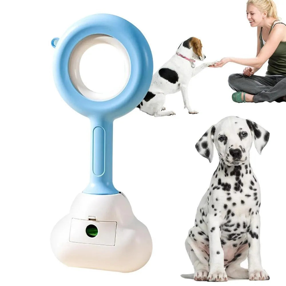 White blue dog pooper scooper with cloud-shaped jaw design on grass