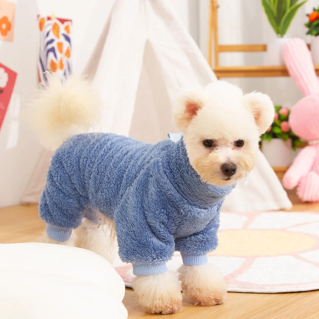 Four-legged dog clothes in blue with high collar and towing ring, showing plush material and full-body coverage