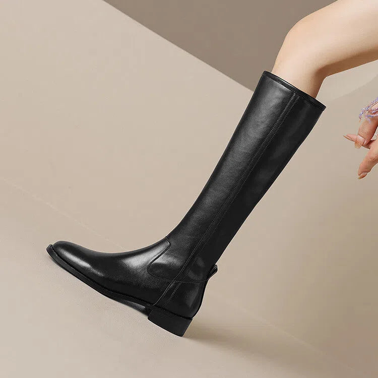 Women's black cowhide leather knee-high riding boots with chunky heel, round toe, and side zipper