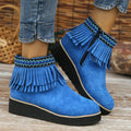 Women's suede wedge ankle boot with side zipper and tassel detail in black