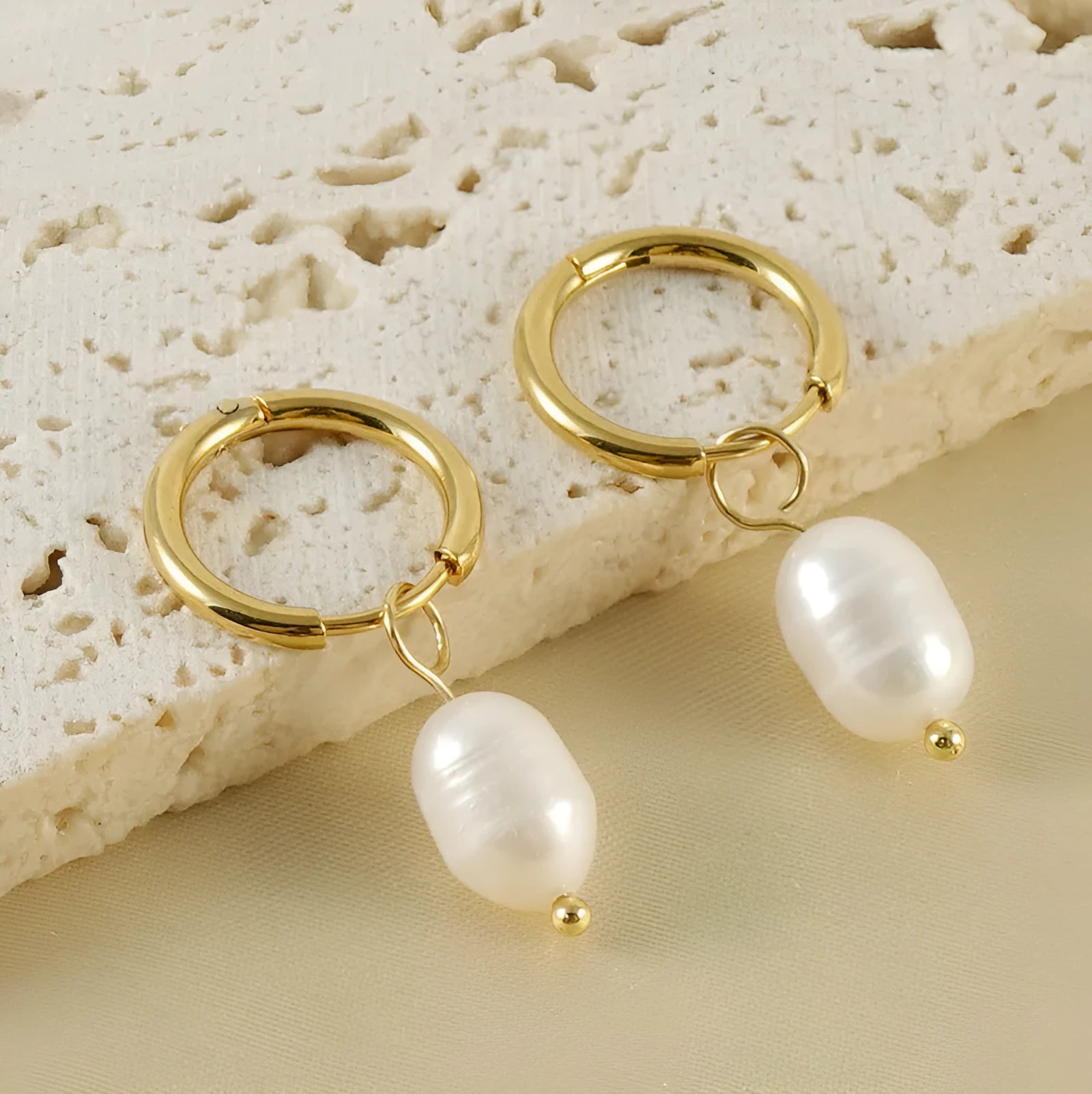 Gold geometric pearl earrings made from stainless steel with titanium steel components