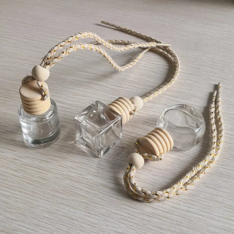 Car empty perfume bottle rearview mirror pendant with colourful rope hanging from car mirror interior