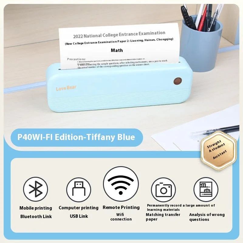 Small white portable thermal printer with USB port on a desk next to A4 paper.