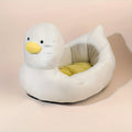 Blue duck-shaped soft polyester pet bed sofa for small dogs and cats on a wooden floor.
