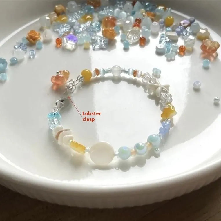 Orange sea coloured alloy bracelet with diamond shape and round element design for women
