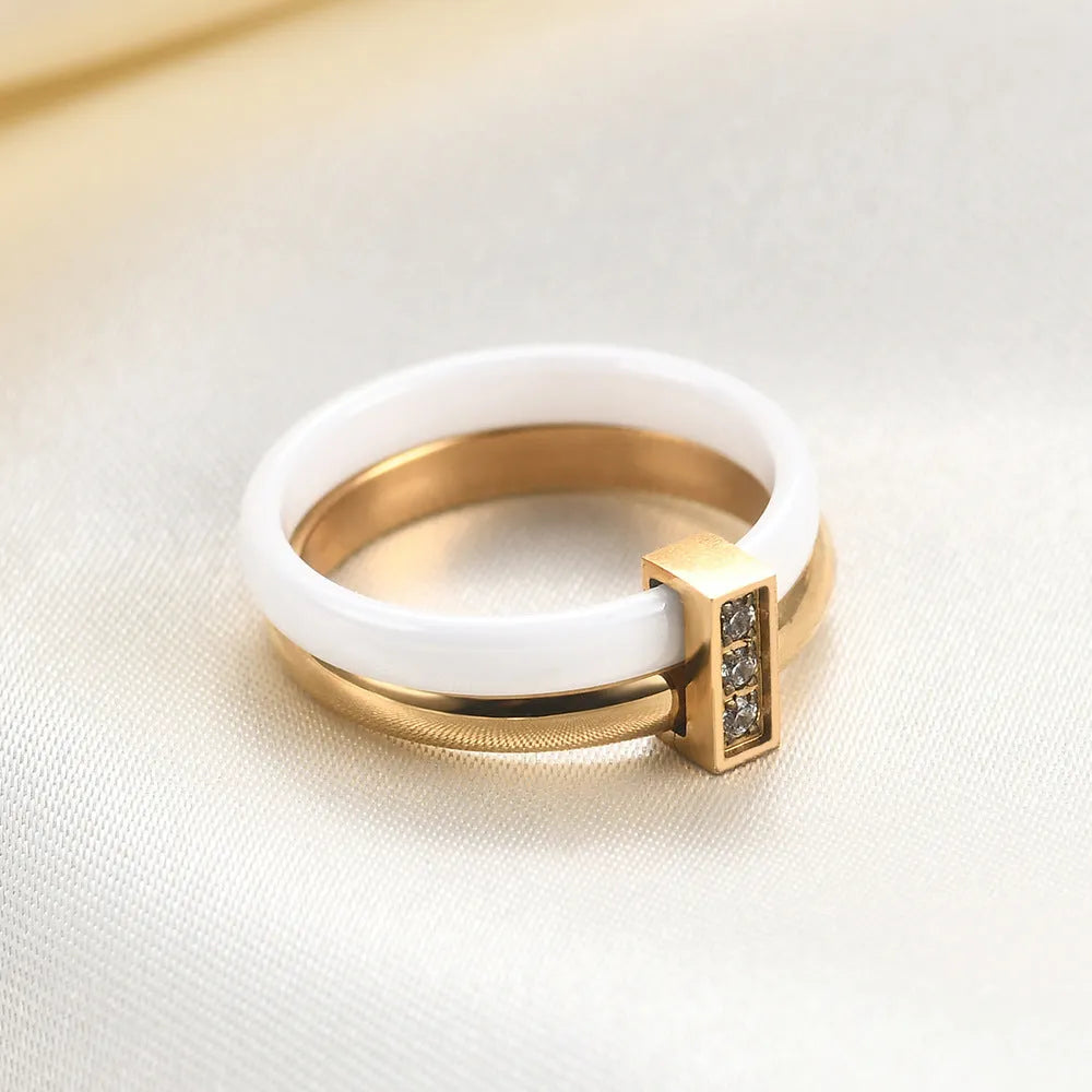 Ceramic geometric ring with glossy stitching and inlaid zirconium on 6MM band, shown in steel black and gold white finishes