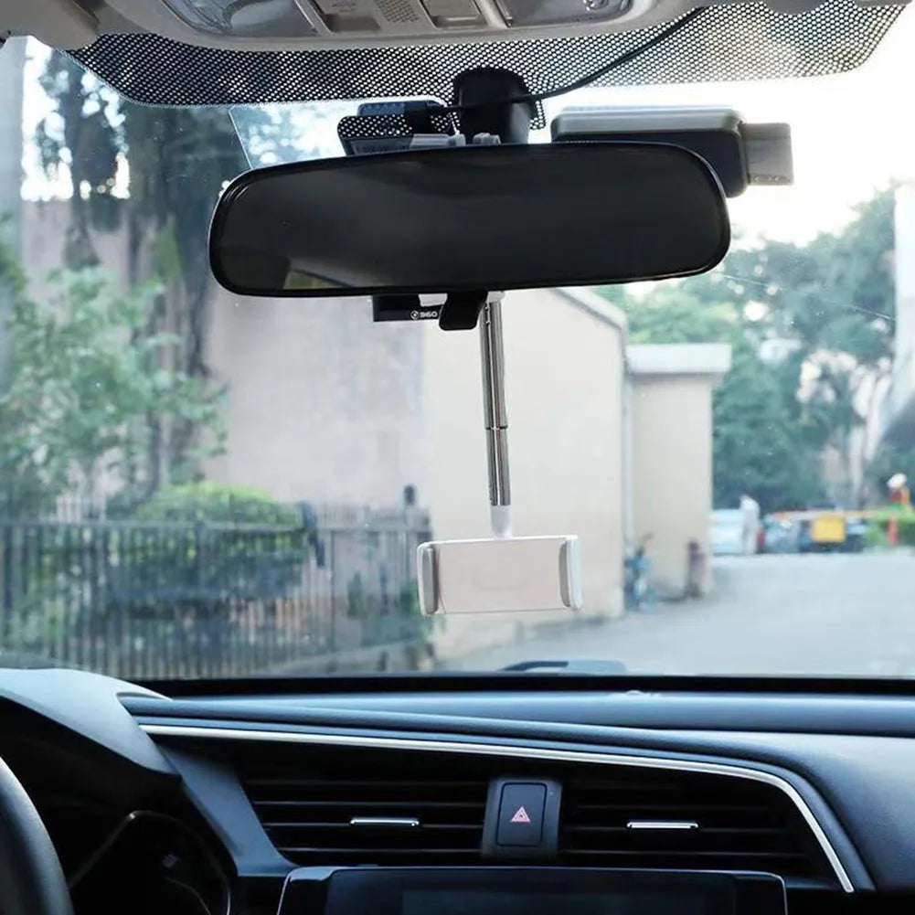 Black ABS car phone holder with 360-degree rotating mechanism mounted on car dashboard