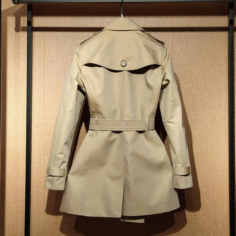 Khaki double-breasted polyester trench coat for women with flight sleeves on a hanger.