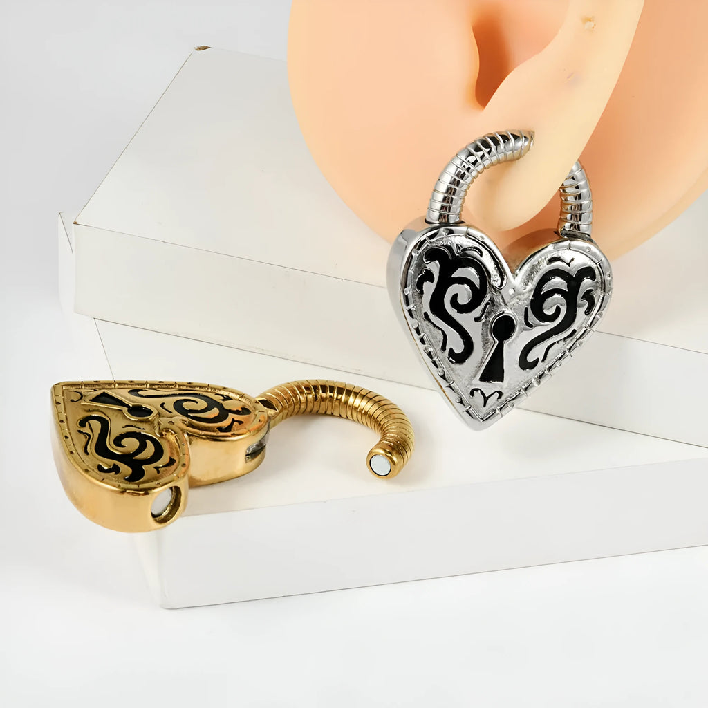 Close-up of a stainless steel heart-shaped earring with a gold-coloured electroplated finish.